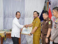 Bupati Kampar Terima Penghargaan dihari Bakti IMIPAS RI ke-61