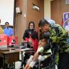 Bupati Kampar Serahkan Alat Bantu Disabilitas dan Bantuan ATENSI Kemensos RI Kepada 134 Penerima Manfaat